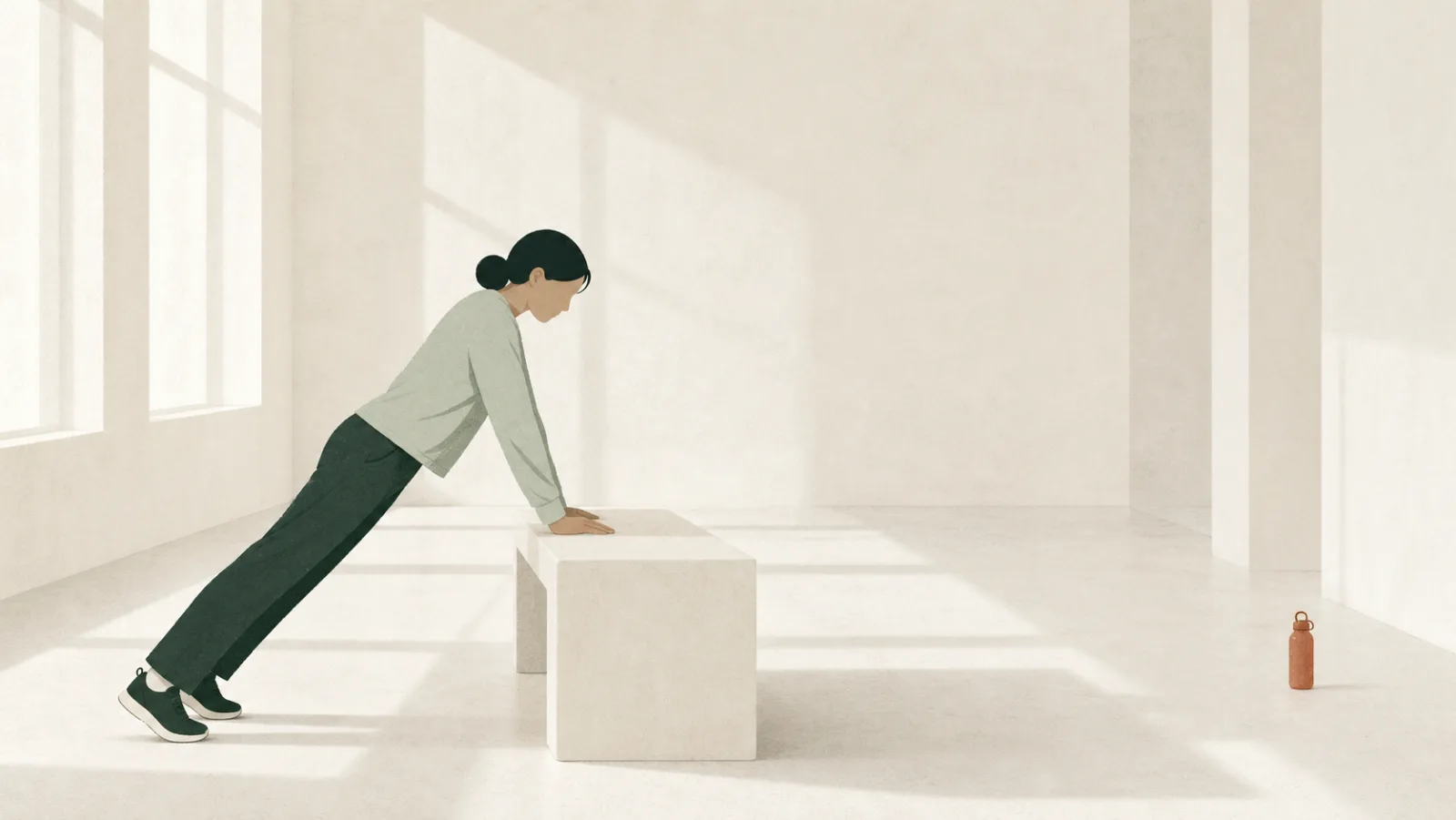 An illustration of a person doing an incline push-up with their hands on a low bench, seen from the side in a bright, near-empty room.